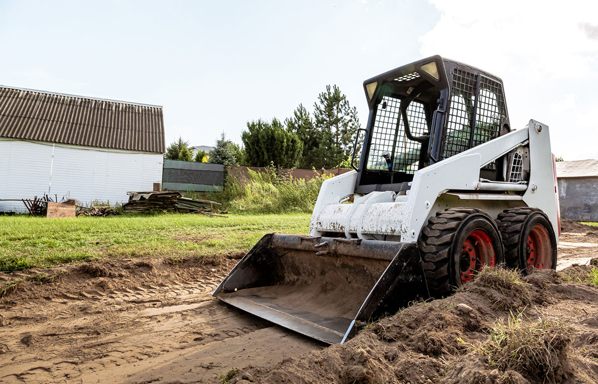 Skid steer versus backhoe